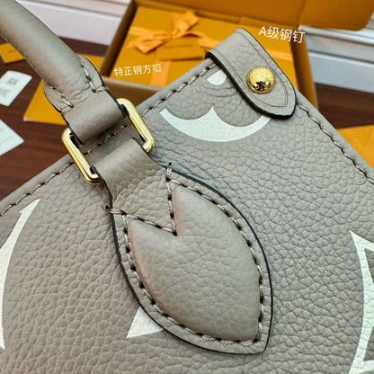 LV Onthego mm Beige Bicolor Monogram Empreinte M47054 Bag